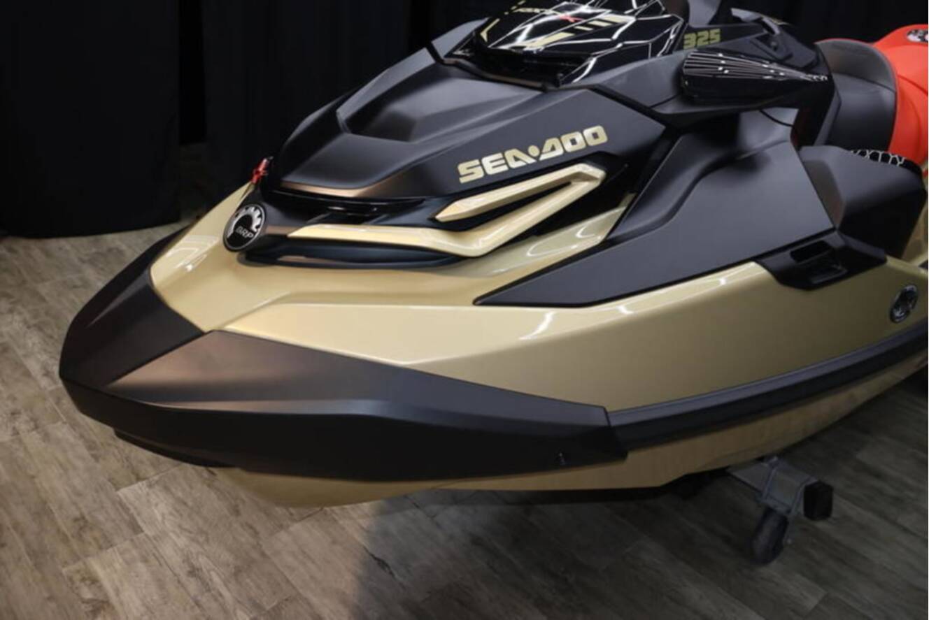 A photo of this 2025 Sea-Doo RXP-X 325 iBR Metallic Tan / Lava Red Premium