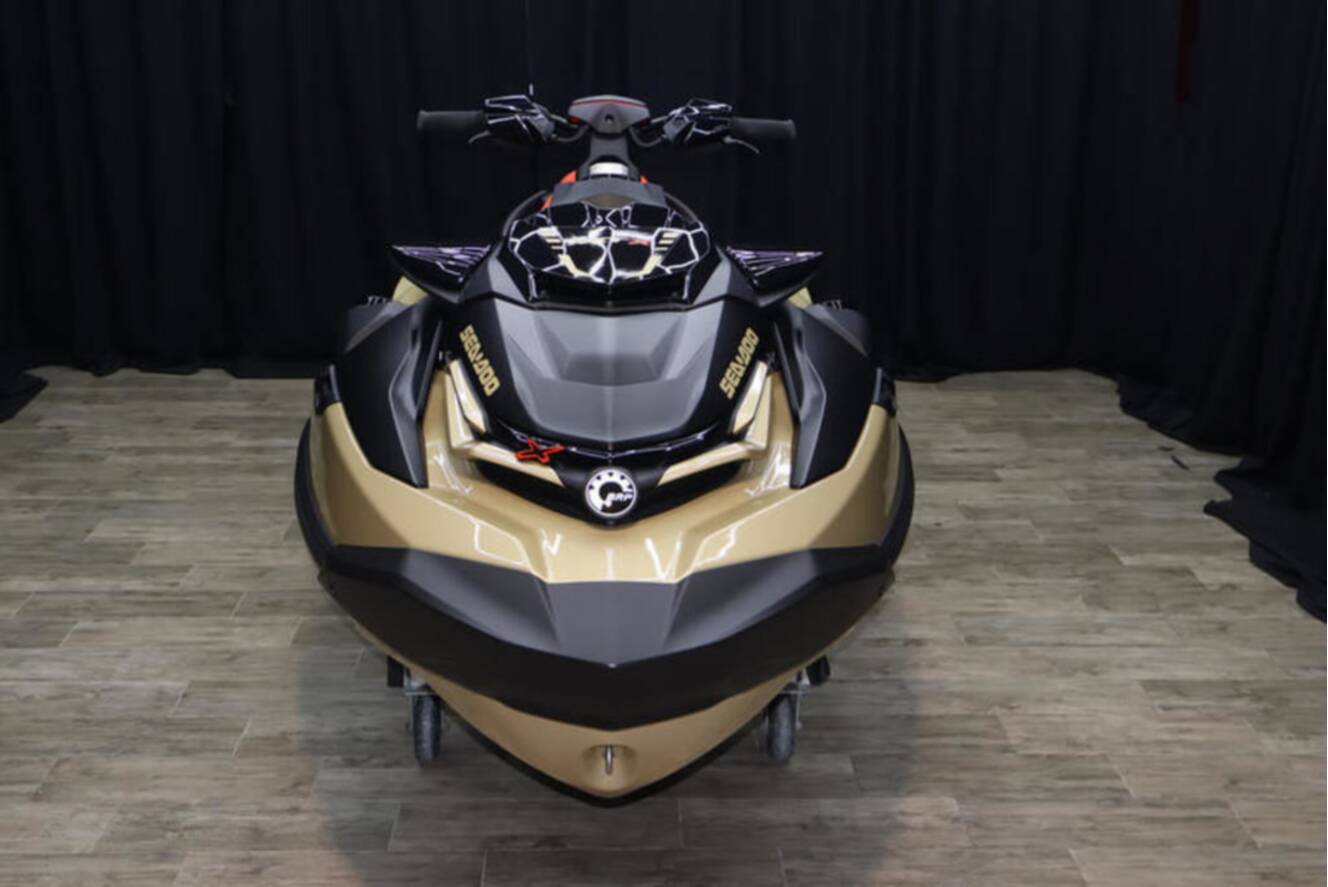 A photo of this 2025 Sea-Doo RXP-X 325 iBR Metallic Tan / Lava Red Premium