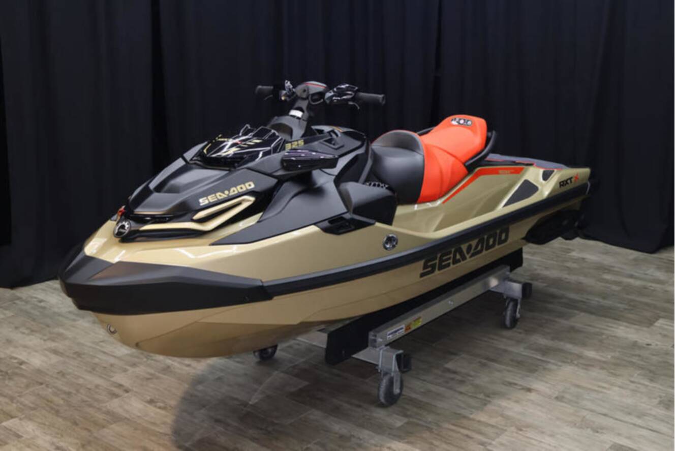 A photo of this 2025 Sea-Doo RXP-X 325 iBR Metallic Tan / Lava Red Premium
