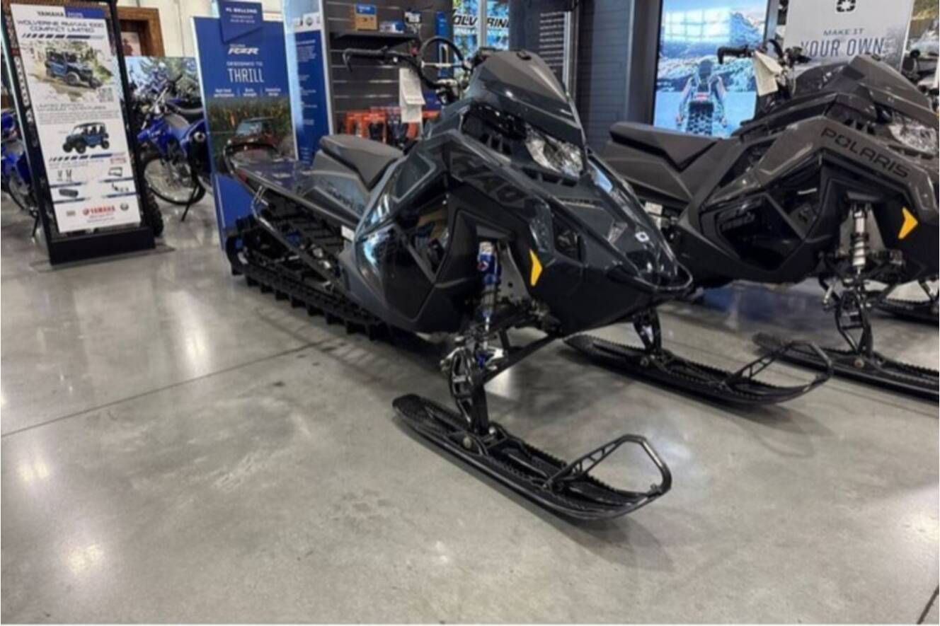 A photo of this 2026 Polaris® SNO-26 BOOST RMK KHAOS 155 Patriot Boost