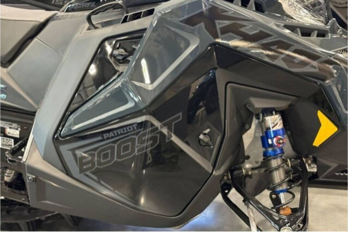 A photo of this 2026 Polaris® SNO-26 BOOST RMK KHAOS 155 Patriot Boost