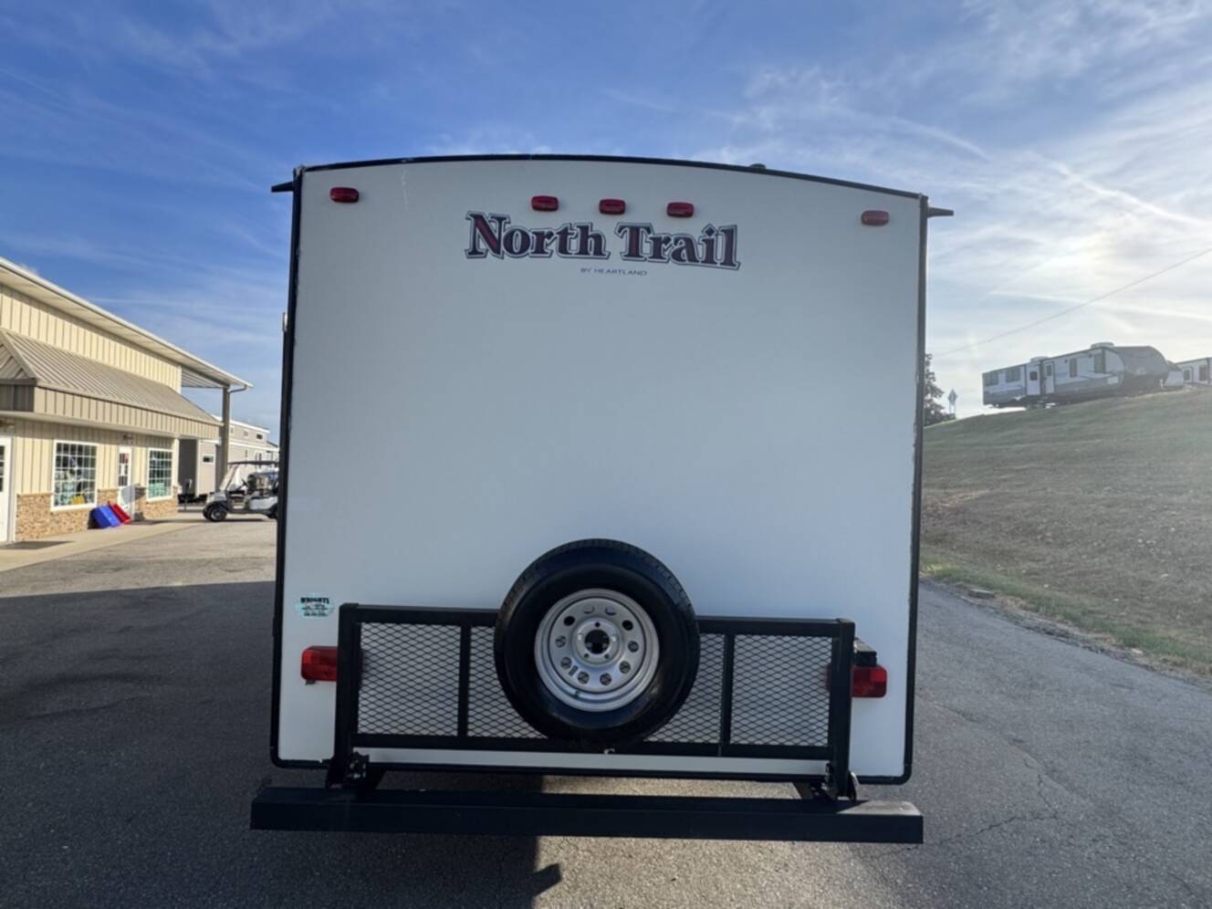 A photo of this 2017 Heartland NORTH TRAIL CALIBER 27RBDS