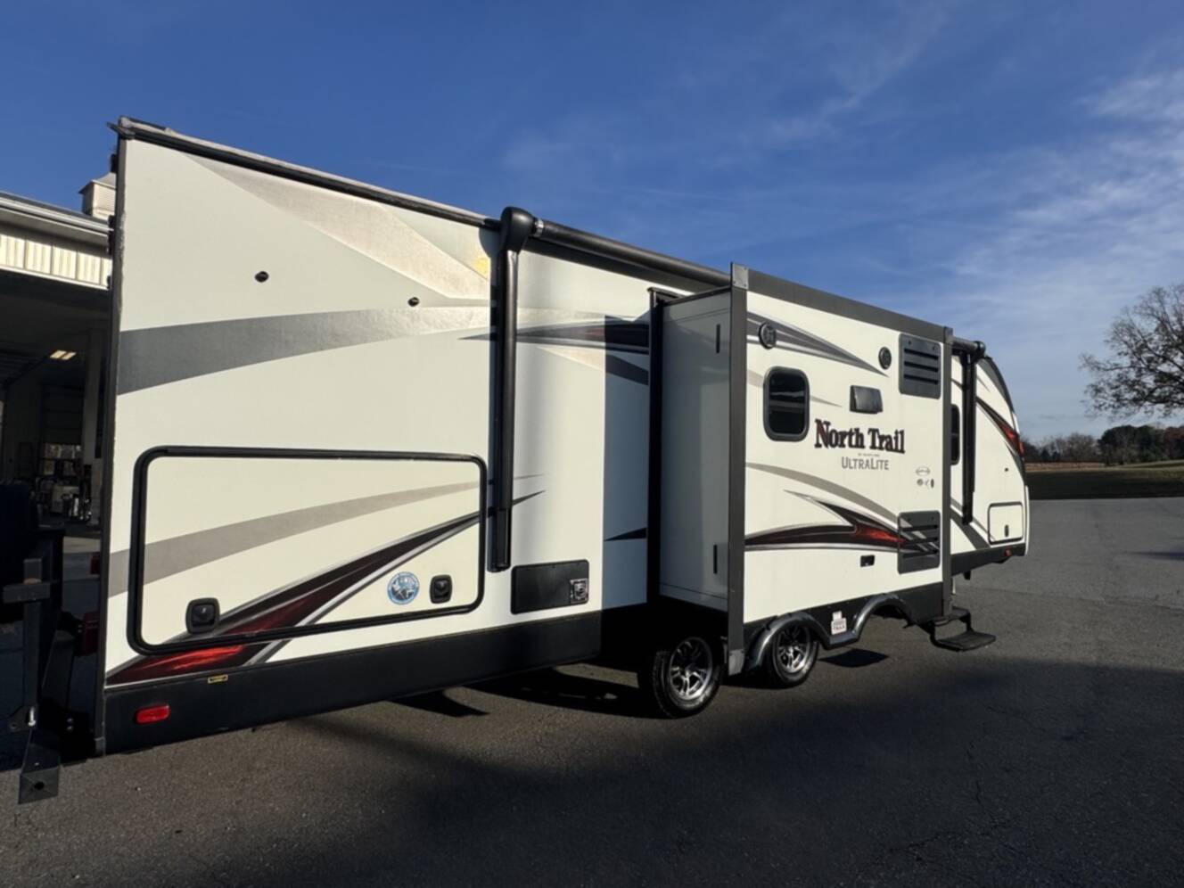 A photo of this 2017 Heartland NORTH TRAIL CALIBER 27RBDS