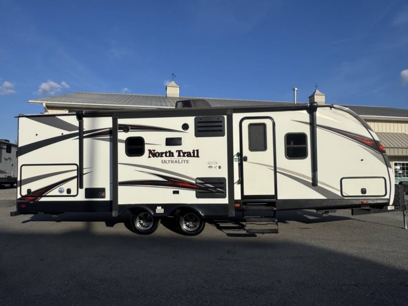 A photo of this 2017 Heartland NORTH TRAIL CALIBER 27RBDS