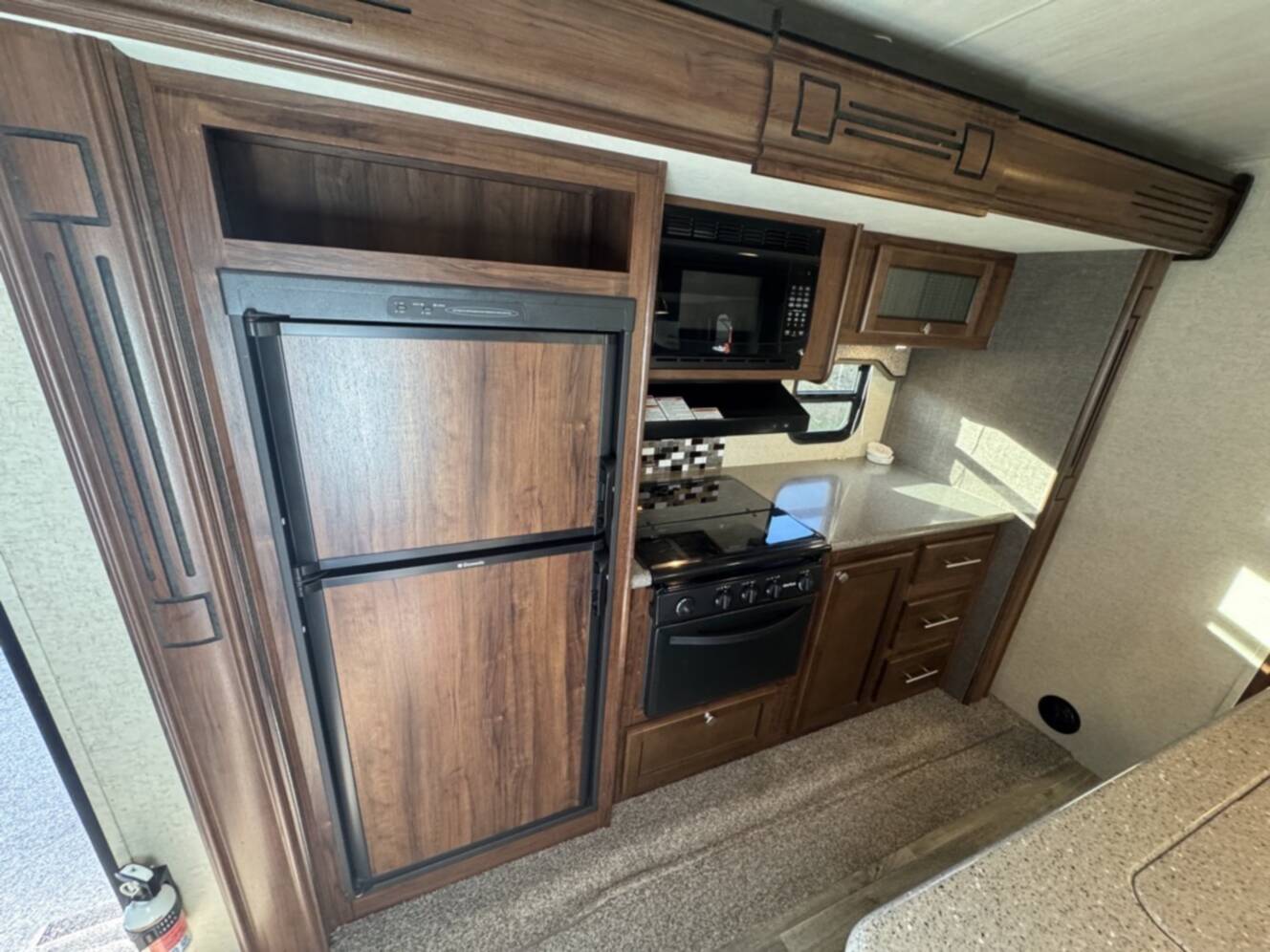 A photo of this 2017 Heartland NORTH TRAIL CALIBER 27RBDS