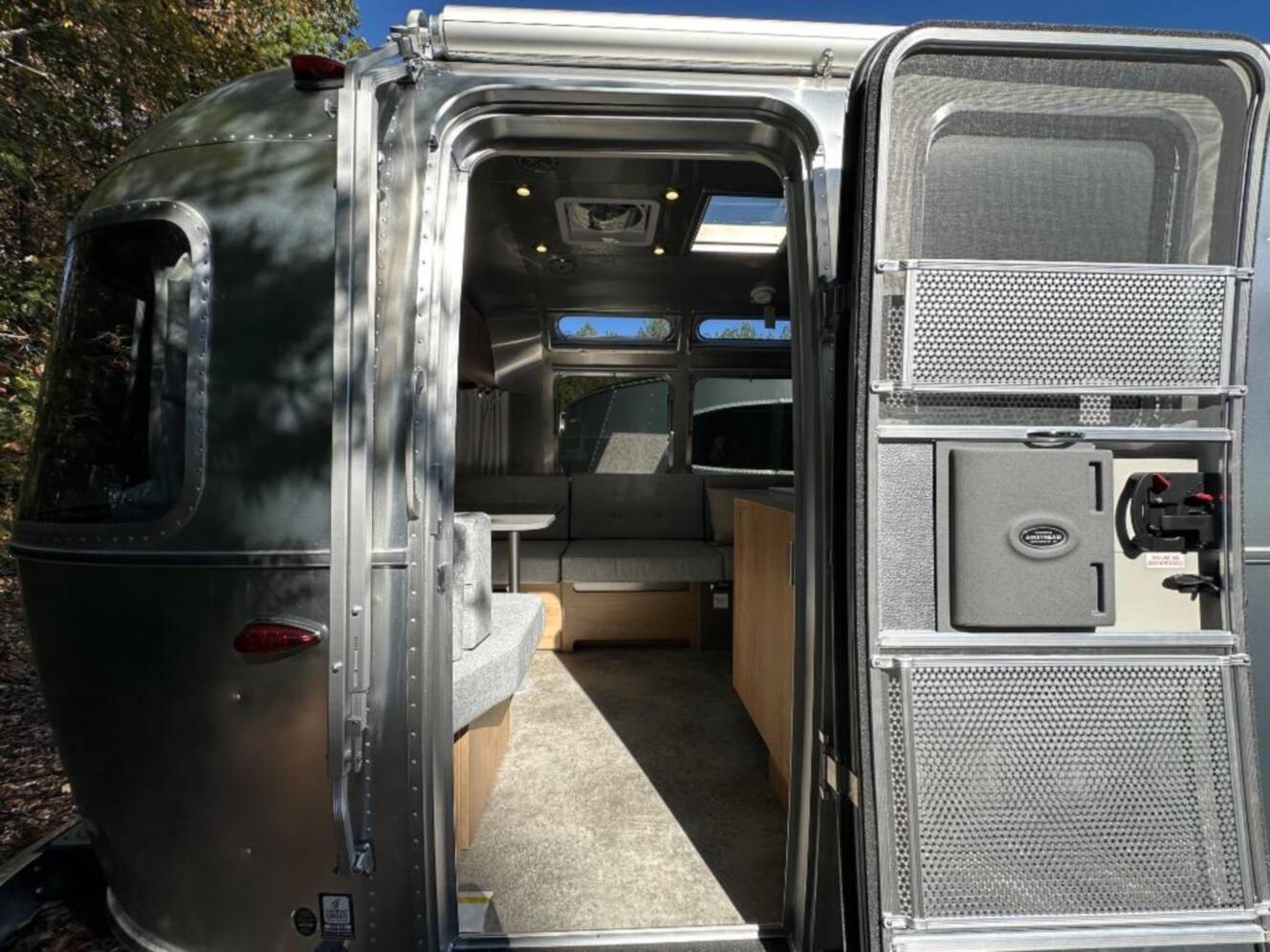A photo of this 2026 Airstream Trade Wind 25FB Queen With Hatch