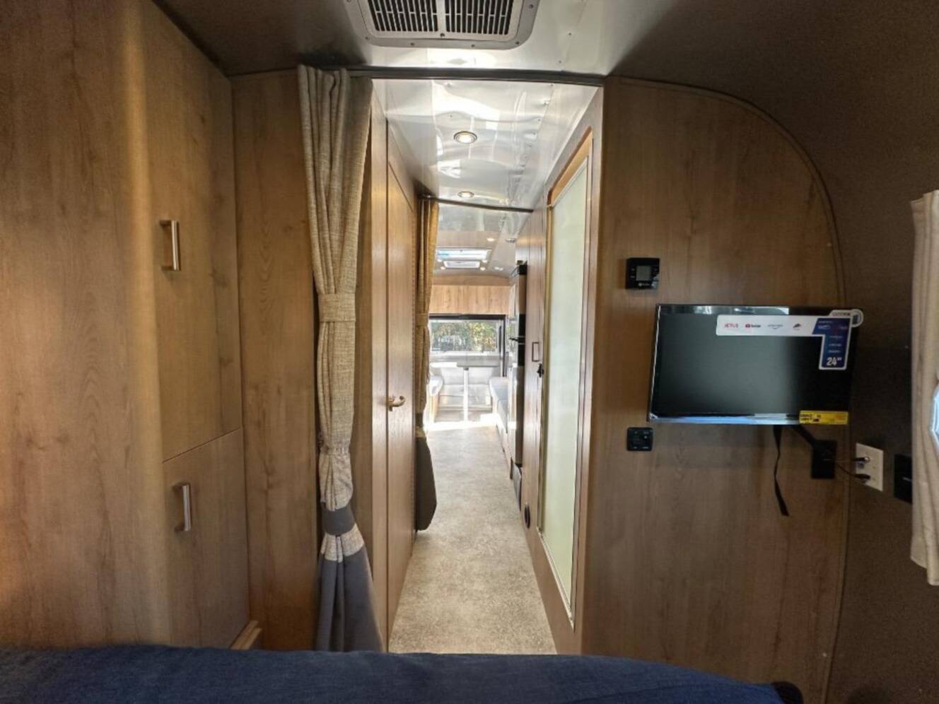 A photo of this 2026 Airstream Trade Wind 25FB Queen With Hatch