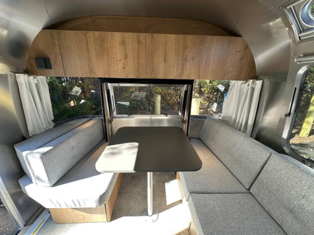 A photo of this 2026 Airstream Trade Wind 25FB Queen With Hatch