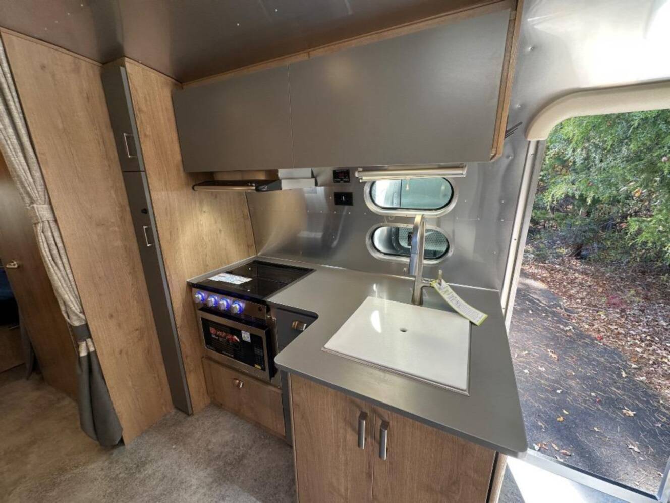 A photo of this 2026 Airstream Trade Wind 25FB Queen With Hatch