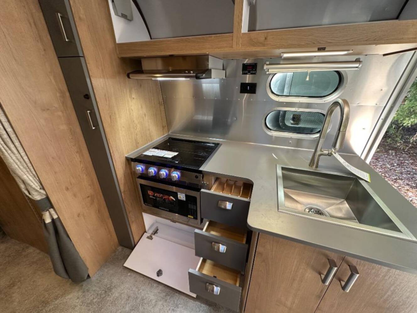 A photo of this 2026 Airstream Trade Wind 25FB Queen With Hatch