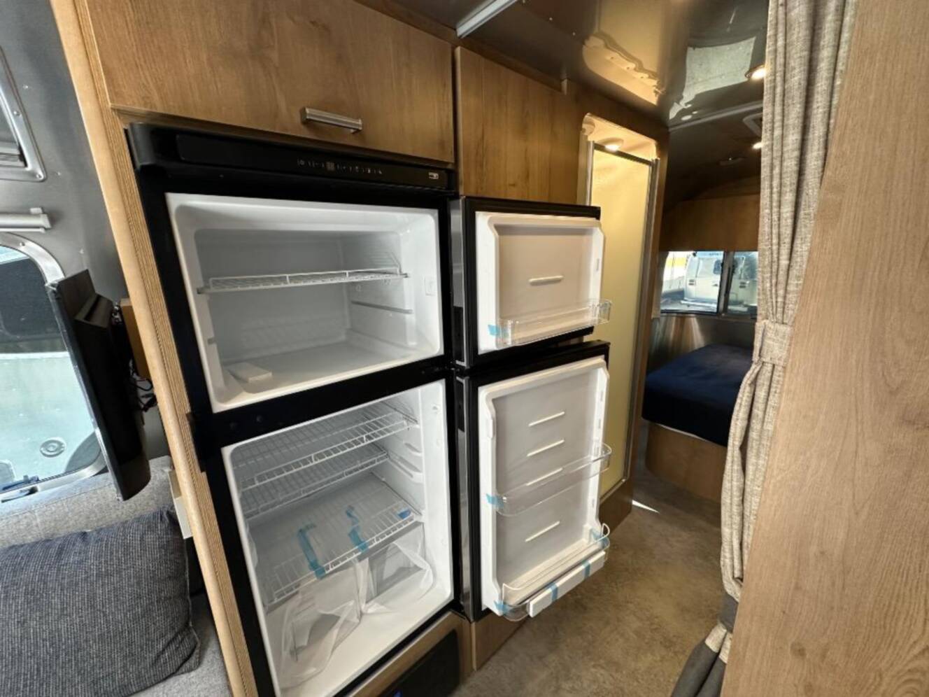 A photo of this 2026 Airstream Trade Wind 25FB Queen With Hatch