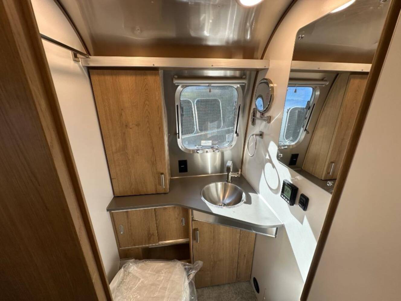 A photo of this 2026 Airstream Trade Wind 25FB Queen With Hatch