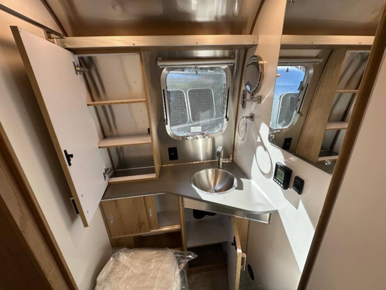 A photo of this 2026 Airstream Trade Wind 25FB Queen With Hatch