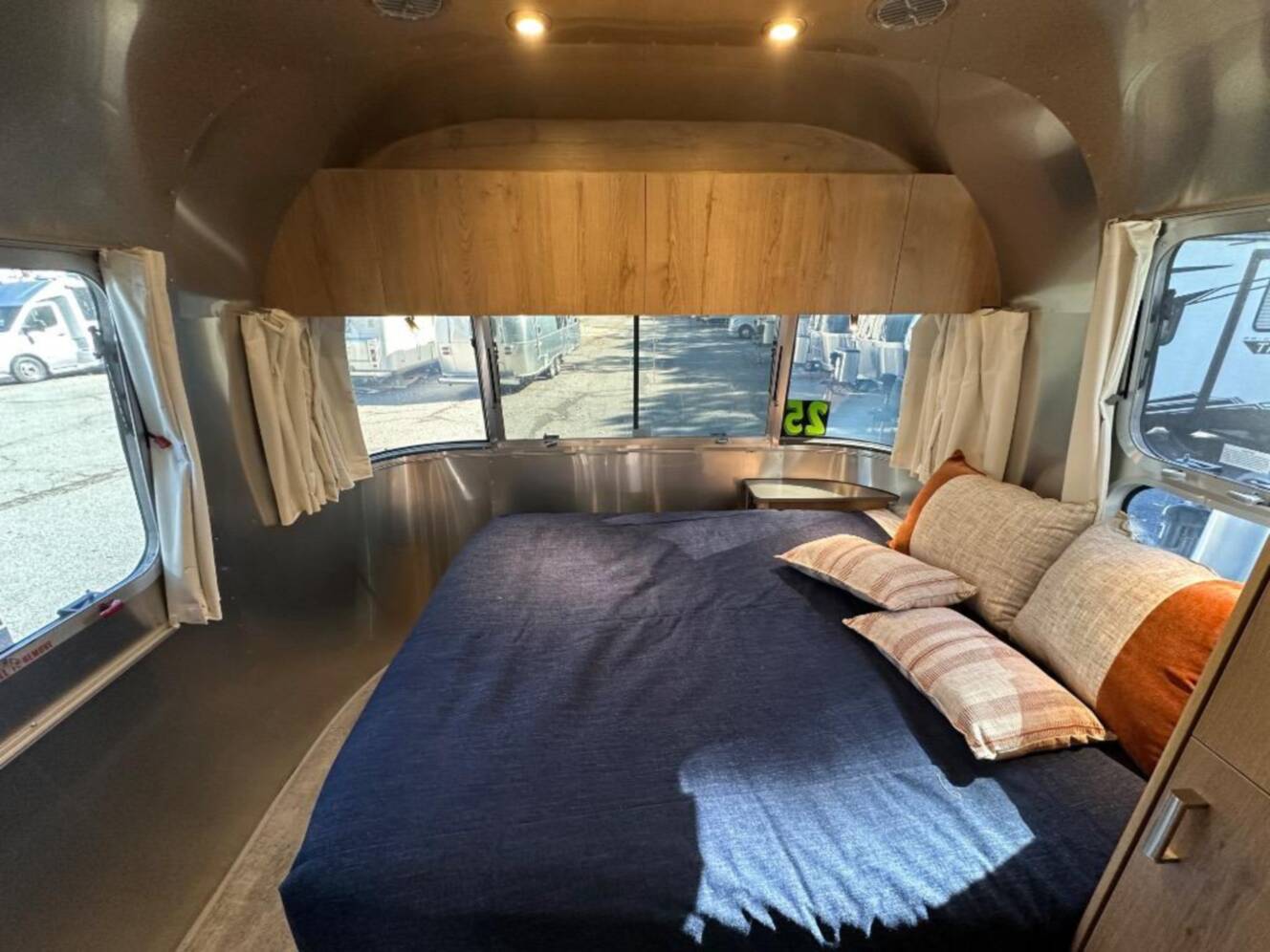 A photo of this 2026 Airstream Trade Wind 25FB Queen With Hatch