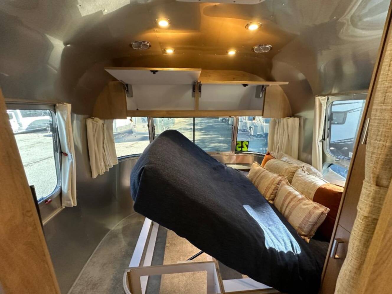 A photo of this 2026 Airstream Trade Wind 25FB Queen With Hatch