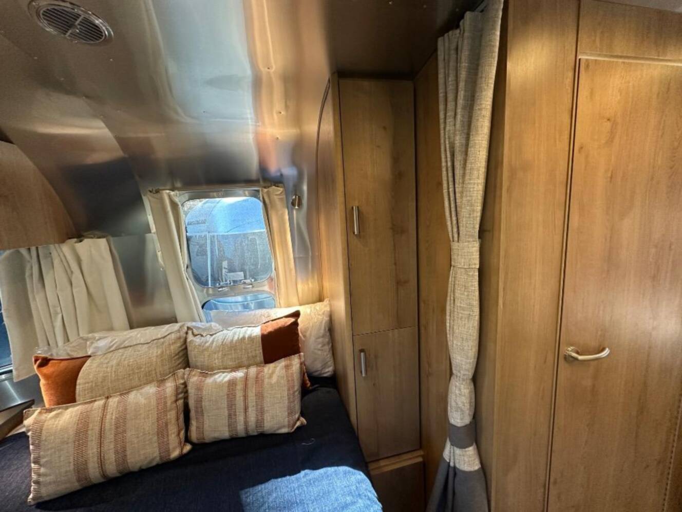 A photo of this 2026 Airstream Trade Wind 25FB Queen With Hatch