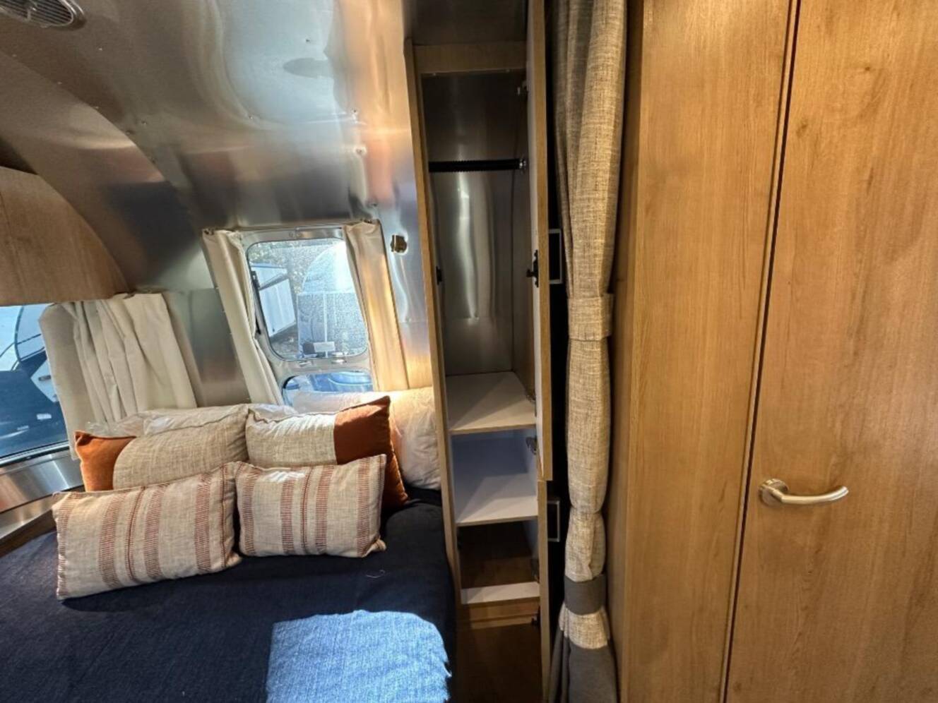 A photo of this 2026 Airstream Trade Wind 25FB Queen With Hatch