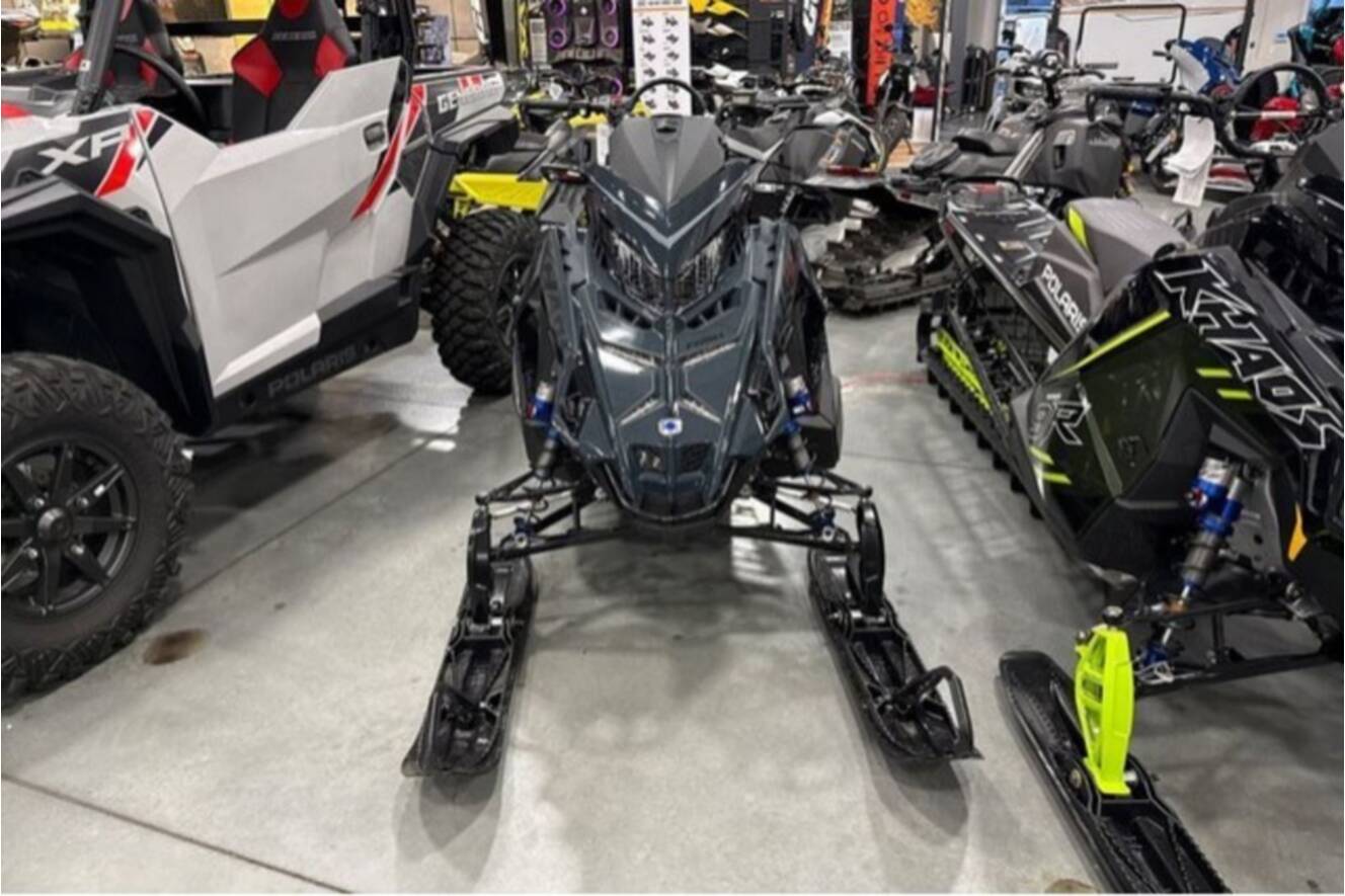 A photo of this 2026 Polaris® SNO-26 BOOST RMK KHAOS 155 Patriot Boost