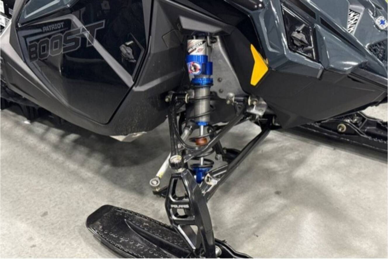 A photo of this 2026 Polaris® SNO-26 BOOST RMK KHAOS 155 Patriot Boost