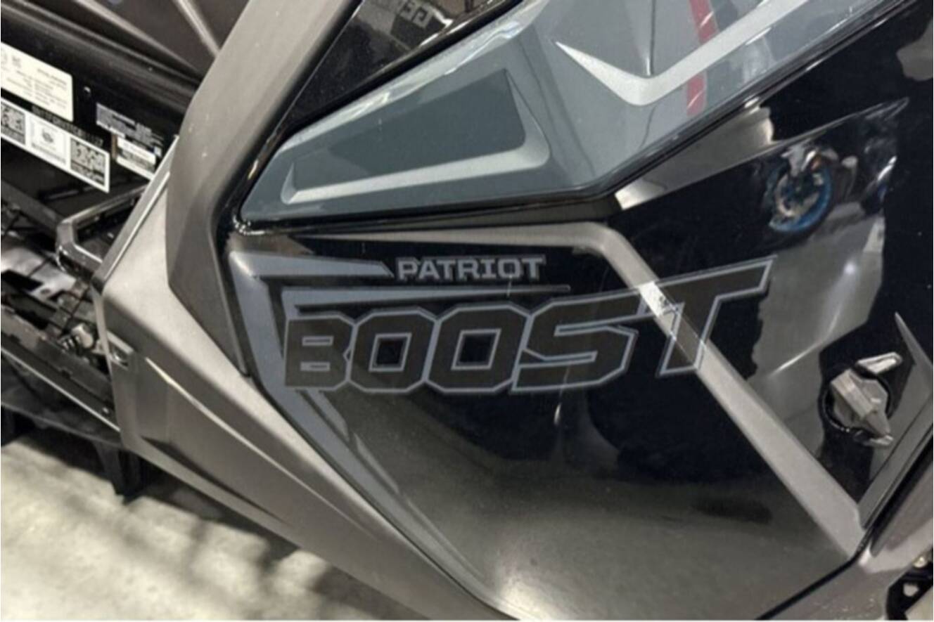 A photo of this 2026 Polaris® SNO-26 BOOST RMK KHAOS 155 Patriot Boost