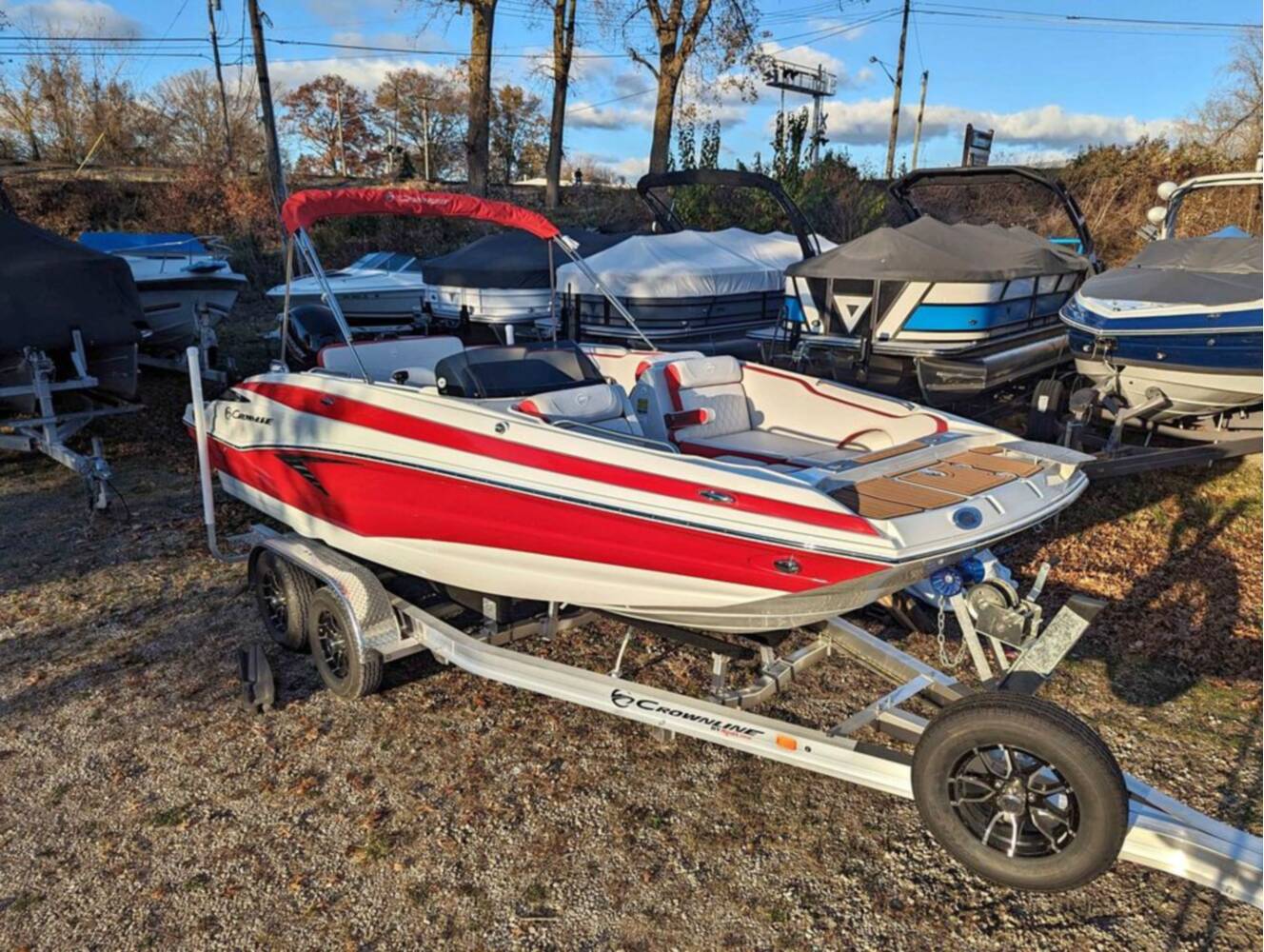 A photo of this 2025 Crownline E210 XS w/ 150 HP Mercury Outboard & Matching Trailer