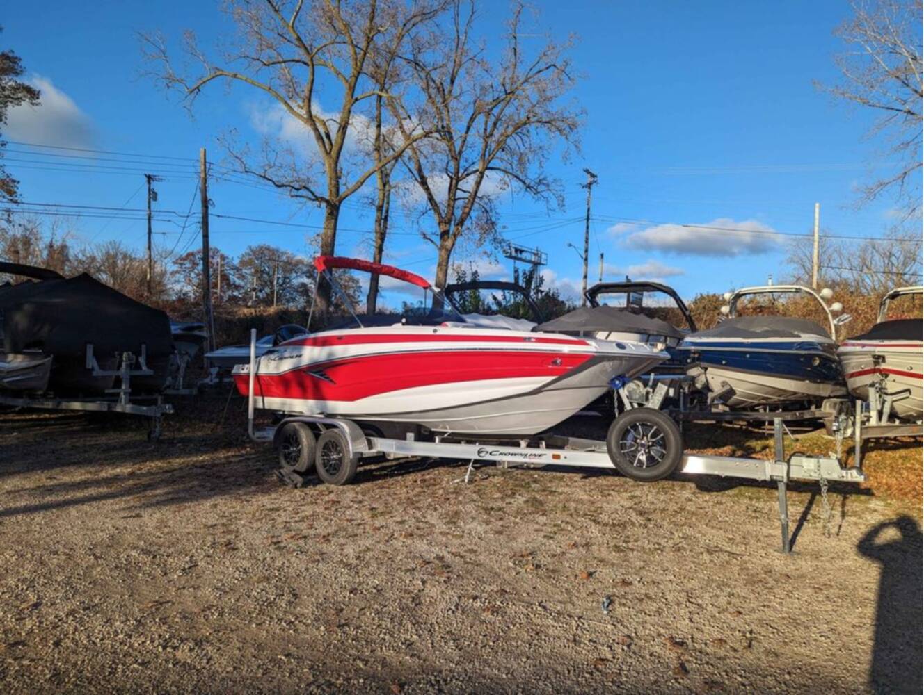 A photo of this 2025 Crownline E210 XS w/ 150 HP Mercury Outboard & Matching Trailer