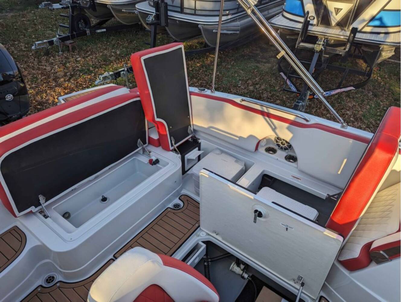 A photo of this 2025 Crownline E210 XS w/ 150 HP Mercury Outboard & Matching Trailer