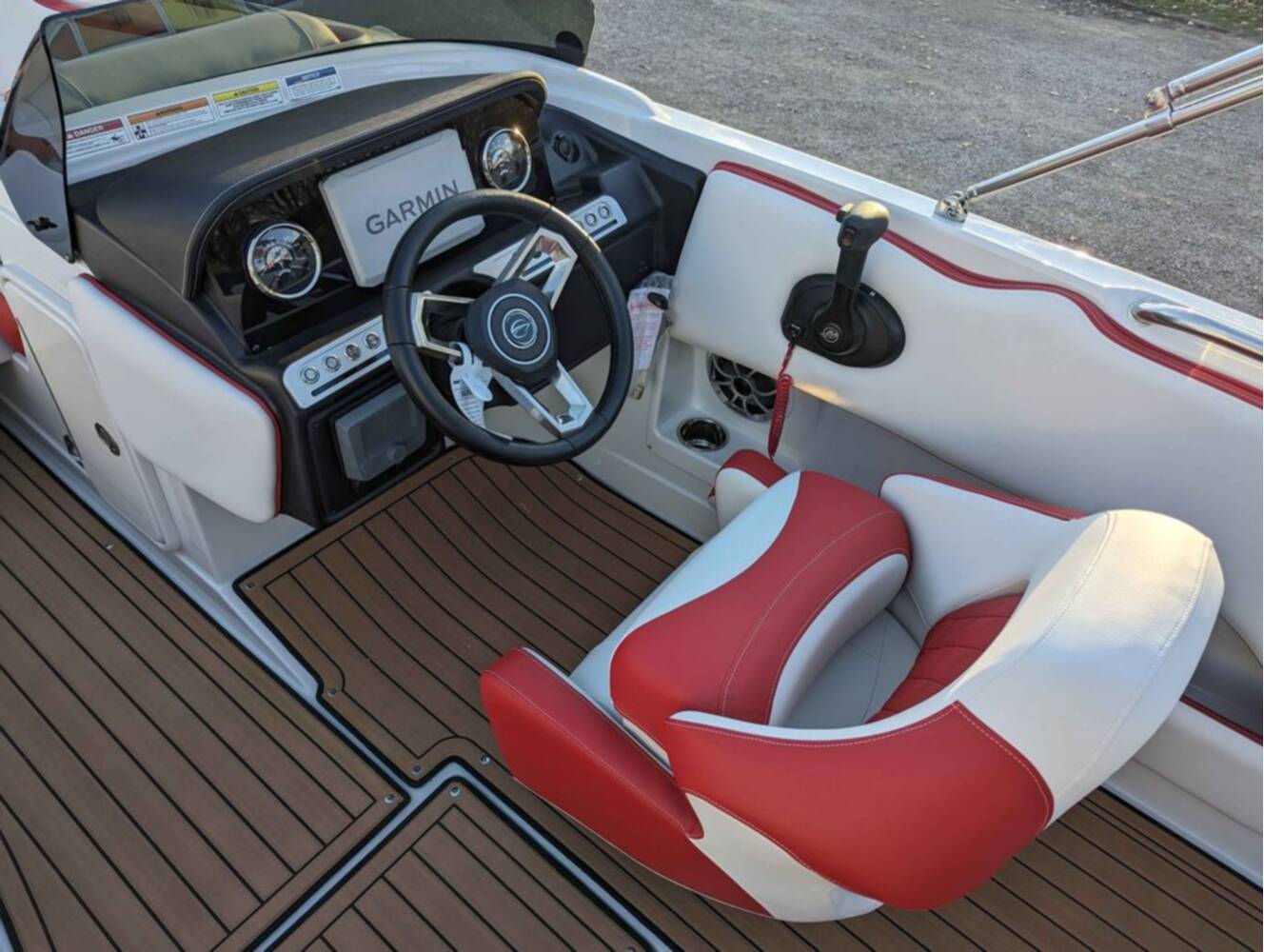 A photo of this 2025 Crownline E210 XS w/ 150 HP Mercury Outboard & Matching Trailer