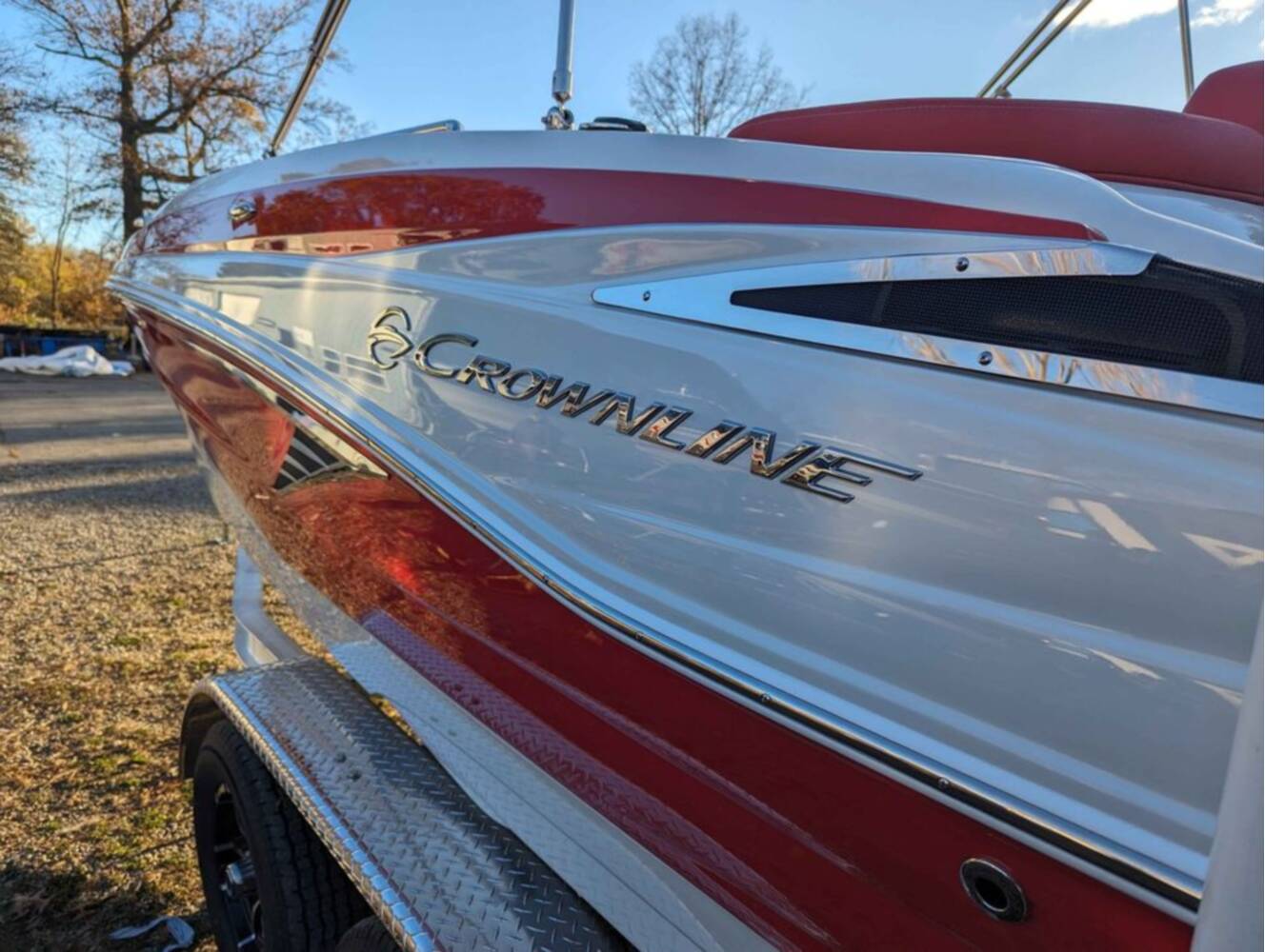 A photo of this 2025 Crownline E210 XS w/ 150 HP Mercury Outboard & Matching Trailer