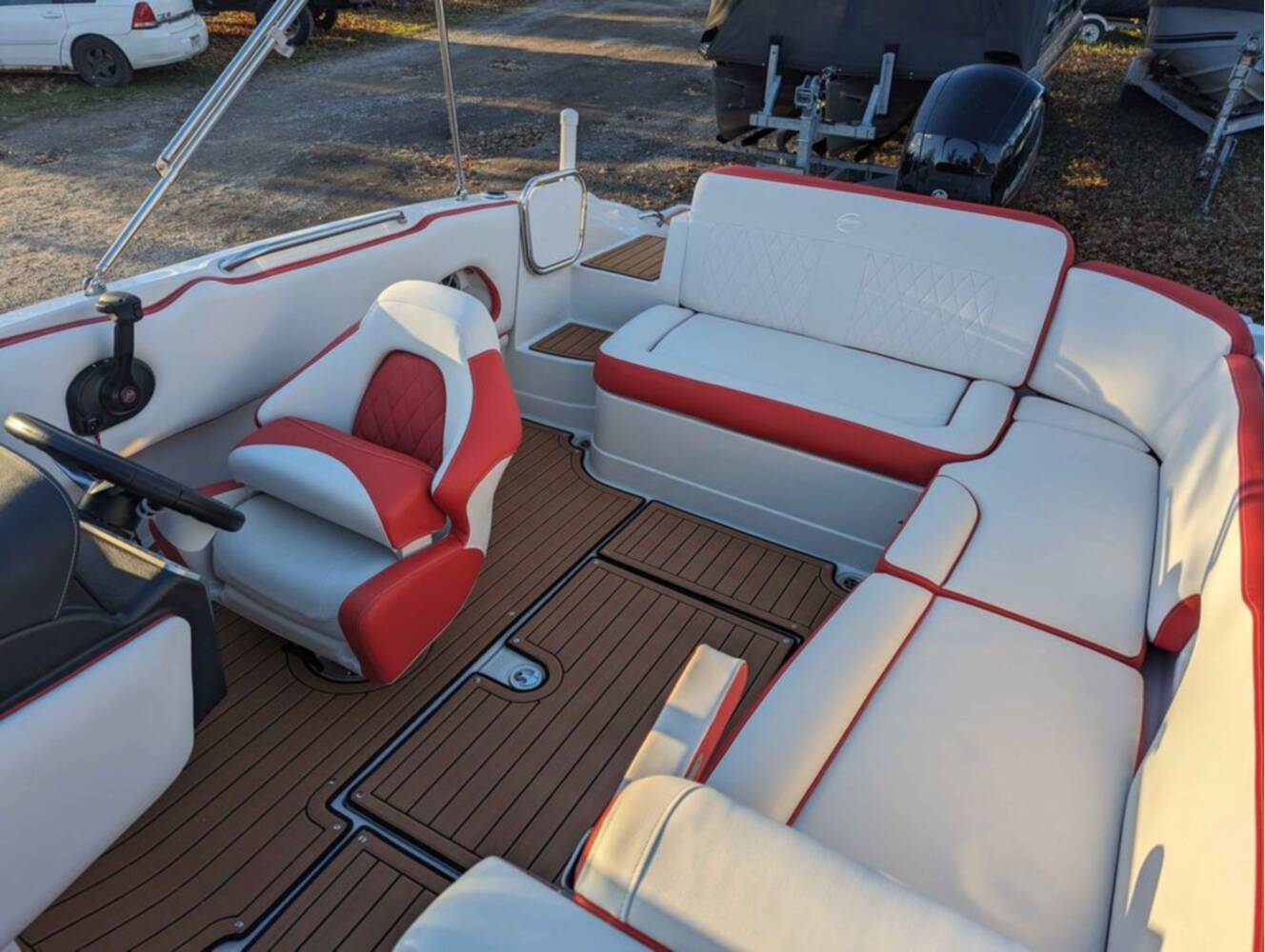 A photo of this 2025 Crownline E210 XS w/ 150 HP Mercury Outboard & Matching Trailer