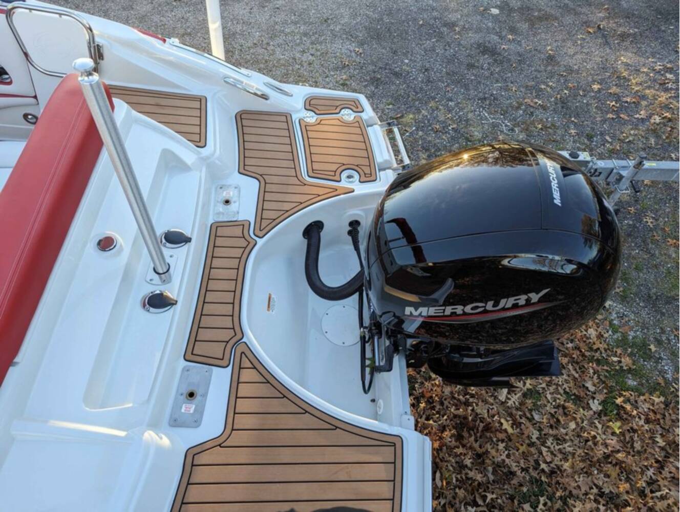A photo of this 2025 Crownline E210 XS w/ 150 HP Mercury Outboard & Matching Trailer