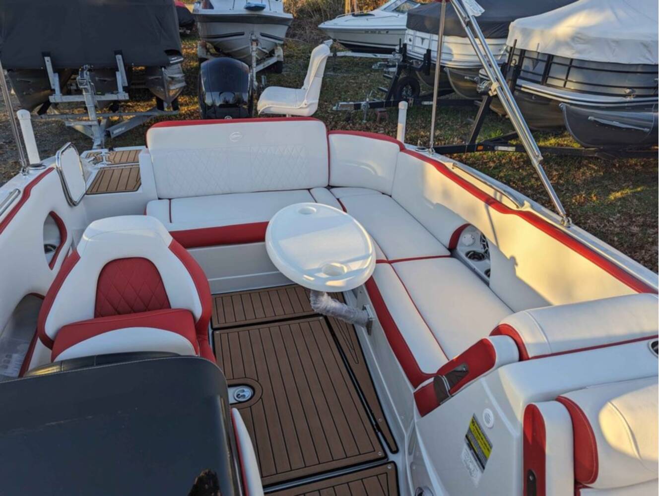 A photo of this 2025 Crownline E210 XS w/ 150 HP Mercury Outboard & Matching Trailer