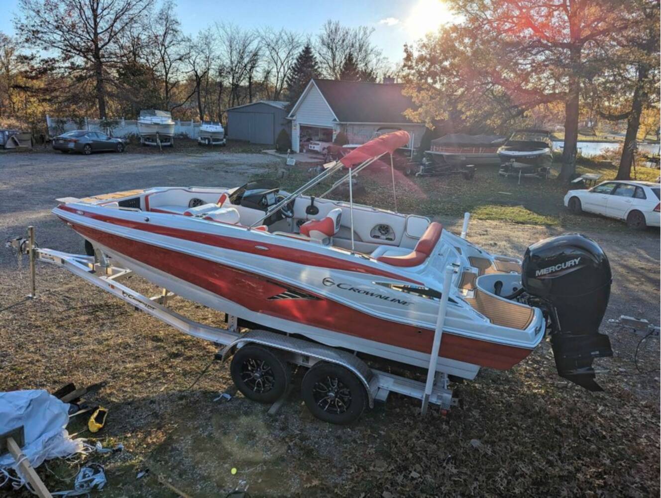 A photo of this 2025 Crownline E210 XS w/ 150 HP Mercury Outboard & Matching Trailer