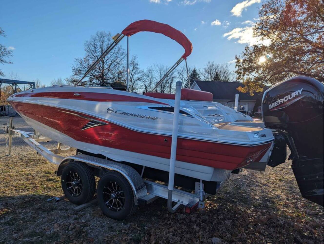 A photo of this 2025 Crownline E210 XS w/ 150 HP Mercury Outboard & Matching Trailer