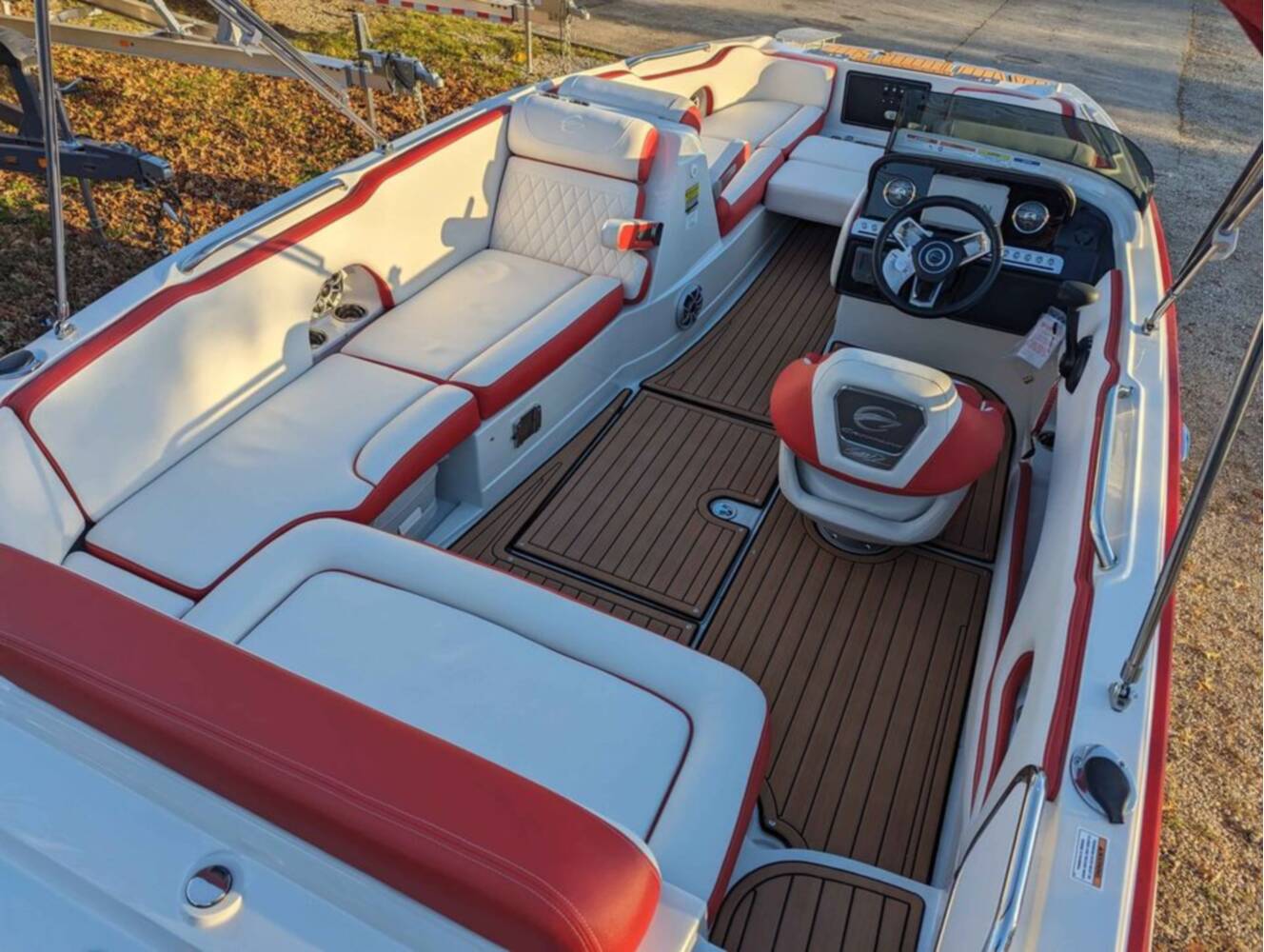 A photo of this 2025 Crownline E210 XS w/ 150 HP Mercury Outboard & Matching Trailer