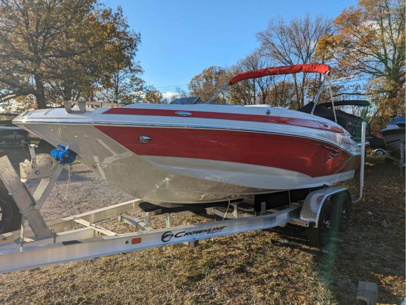 A photo of this 2025 Crownline E210 XS w/ 150 HP Mercury Outboard & Matching Trailer
