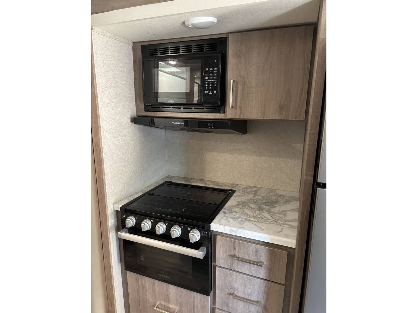 A photo of this 2022 Grand Design IMAGINE XLS 22MLE