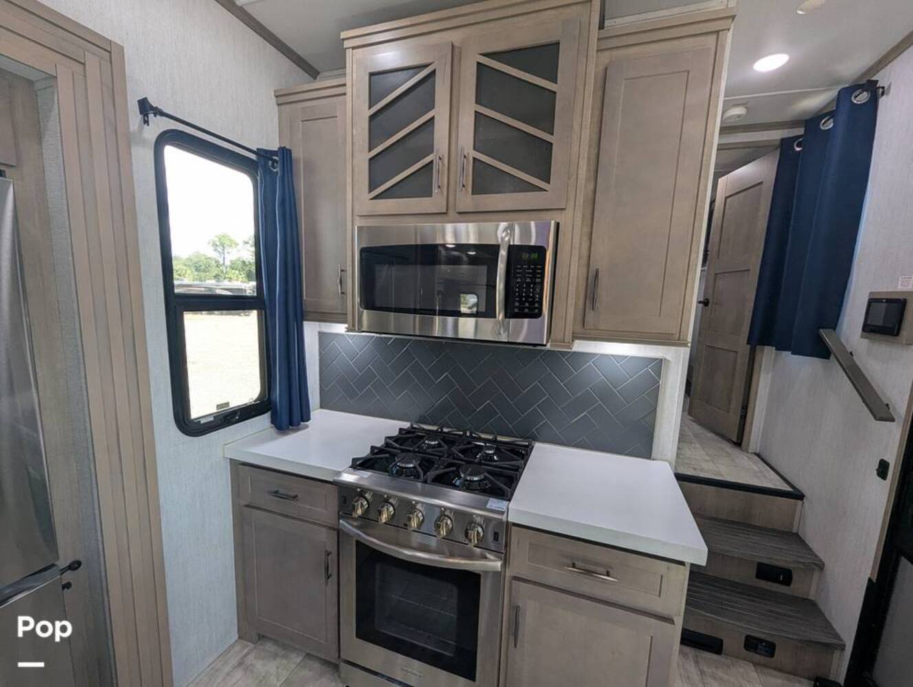 A photo of this 2023 Grand Design Momentum 395MS-R