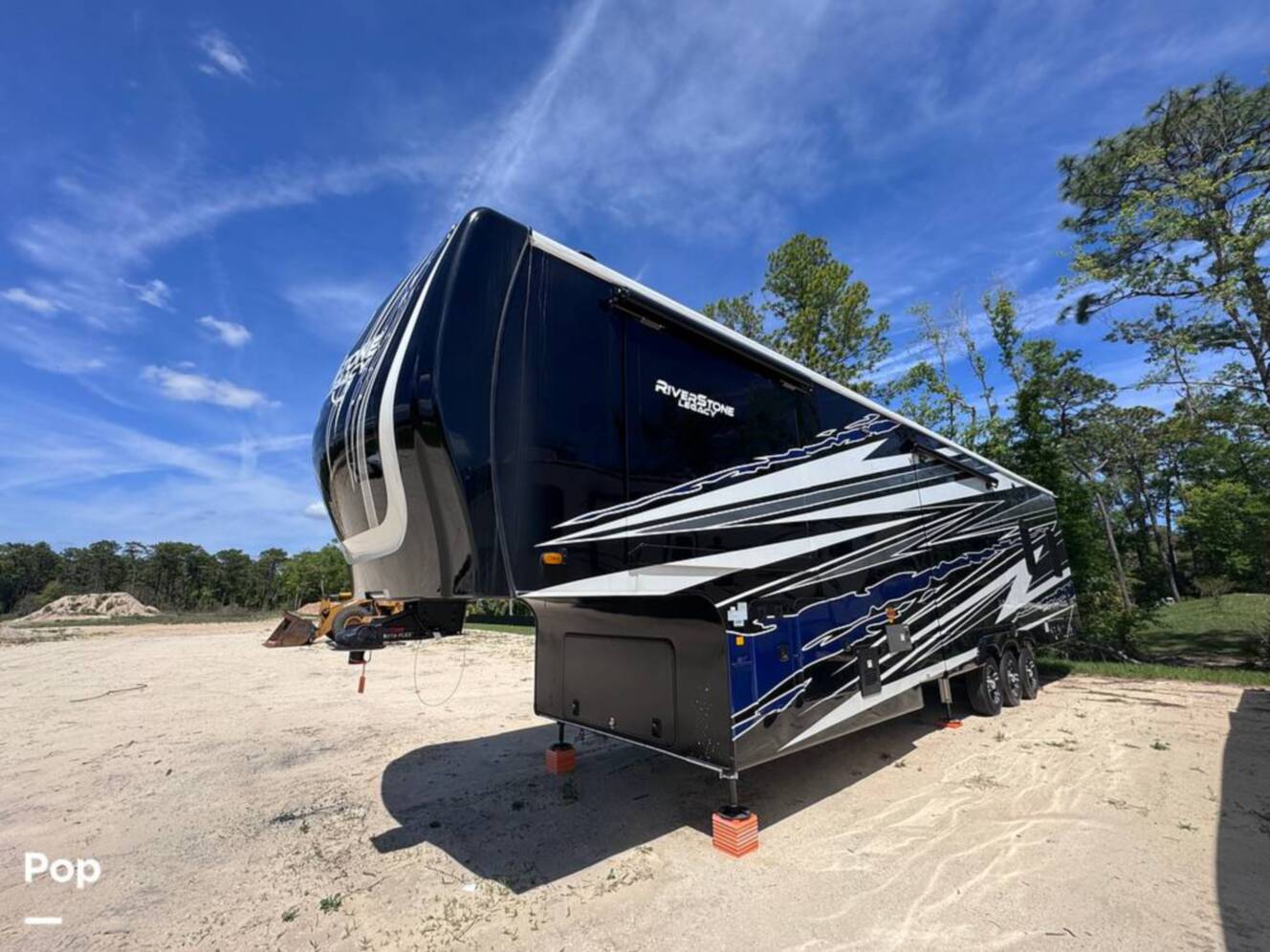 A photo of this 2023 Forest River Riverstone 45BATH Toy Hauler