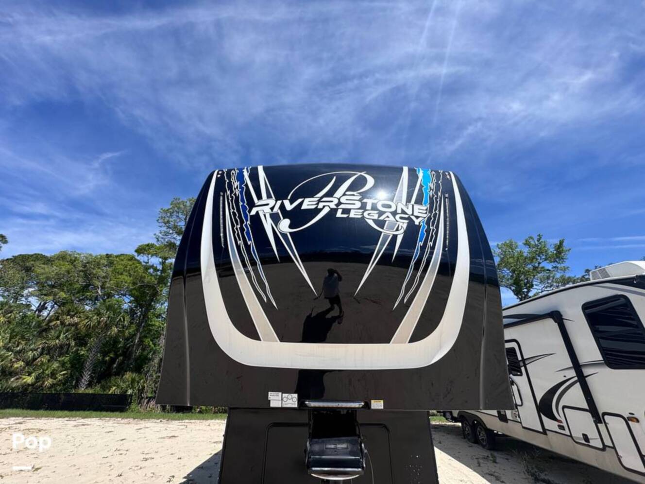 A photo of this 2023 Forest River Riverstone 45BATH Toy Hauler