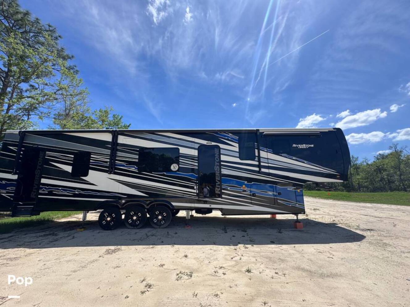 A photo of this 2023 Forest River Riverstone 45BATH Toy Hauler