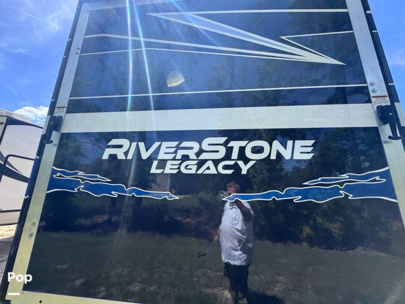 A photo of this 2023 Forest River Riverstone 45BATH Toy Hauler