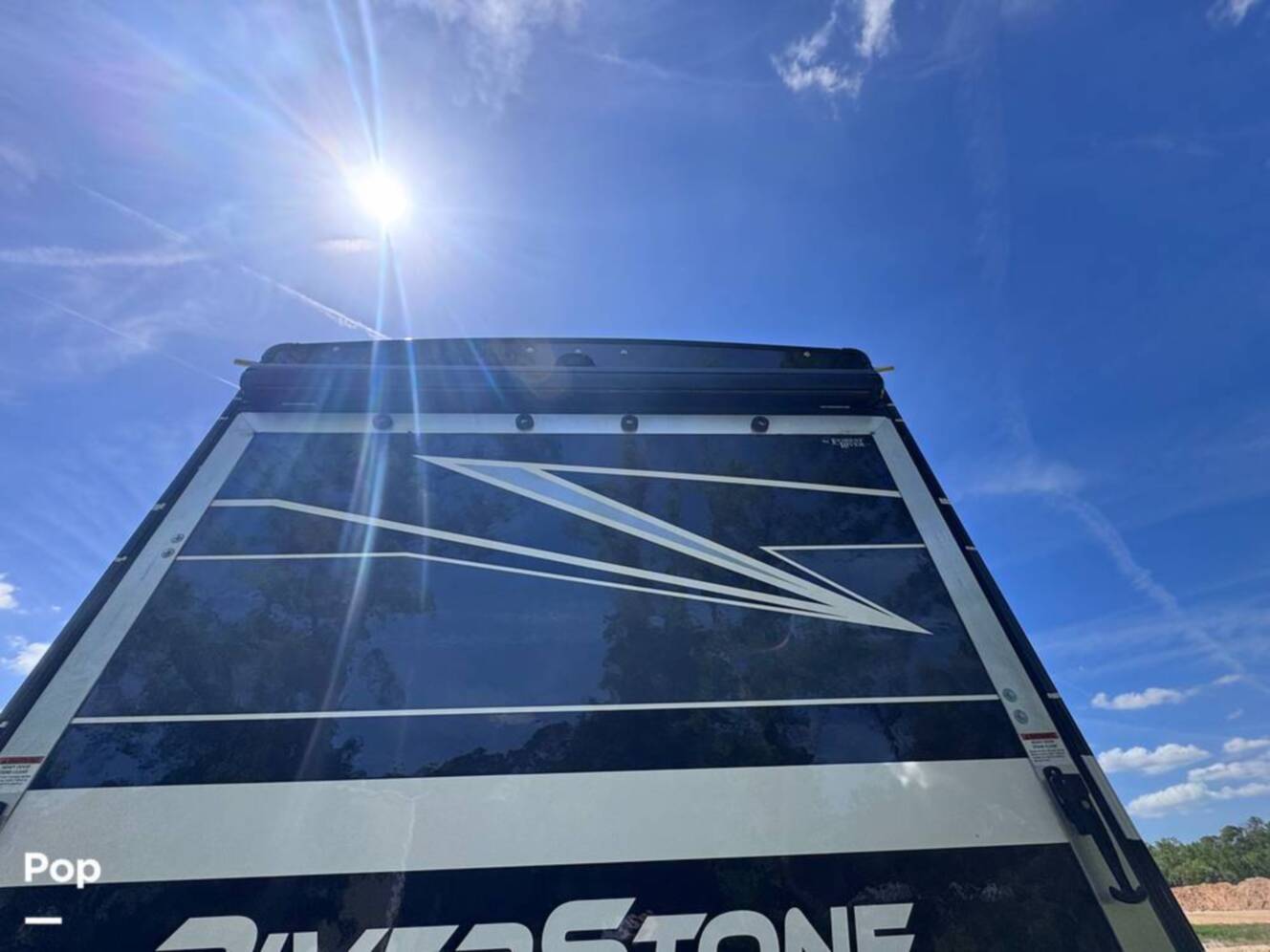 A photo of this 2023 Forest River Riverstone 45BATH Toy Hauler