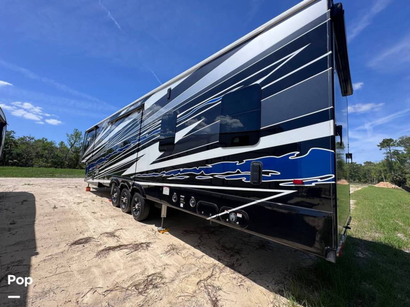 A photo of this 2023 Forest River Riverstone 45BATH Toy Hauler