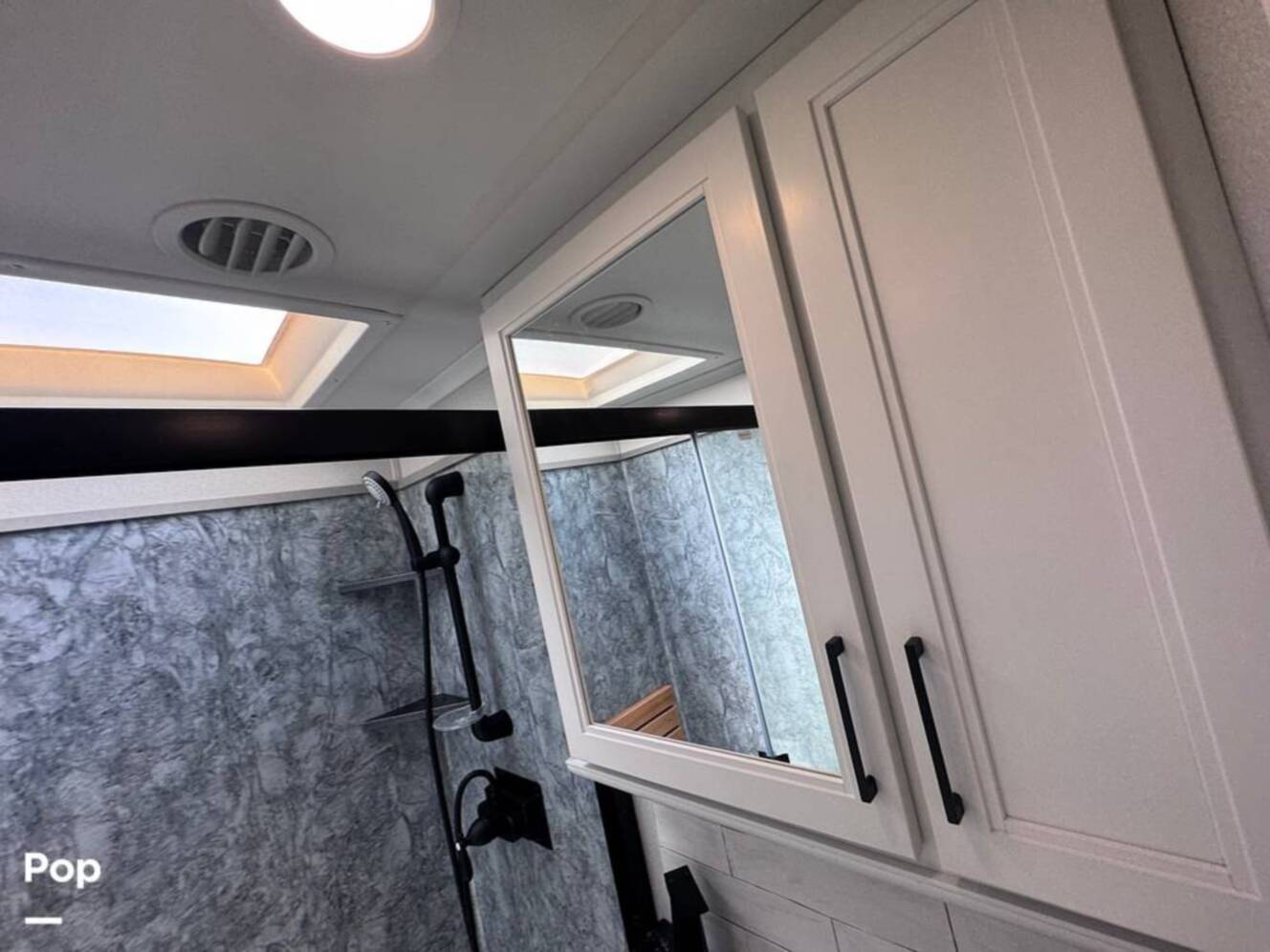 A photo of this 2023 Forest River Riverstone 45BATH Toy Hauler