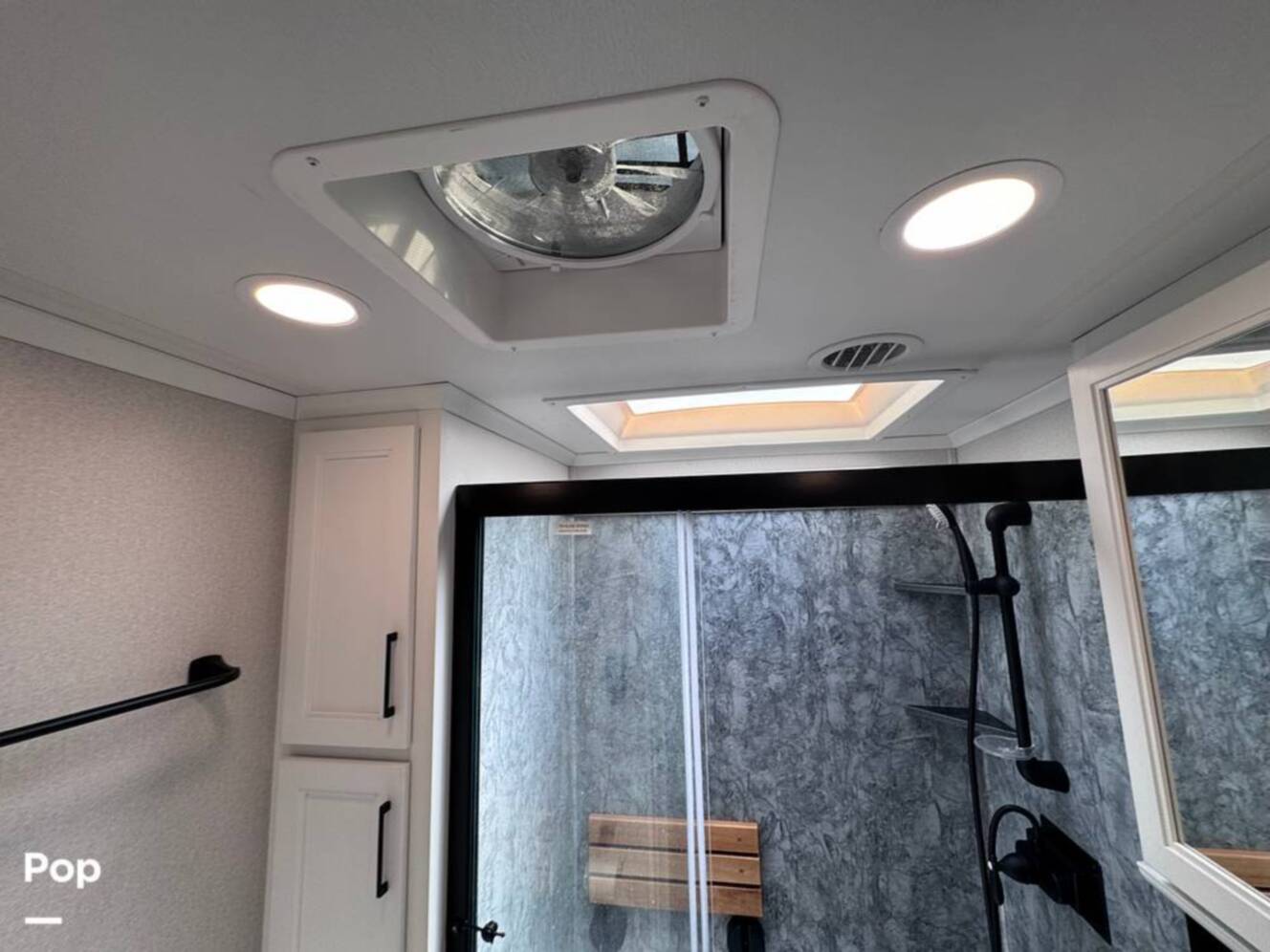 A photo of this 2023 Forest River Riverstone 45BATH Toy Hauler