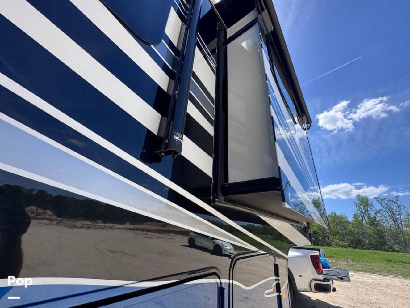 A photo of this 2023 Forest River Riverstone 45BATH Toy Hauler