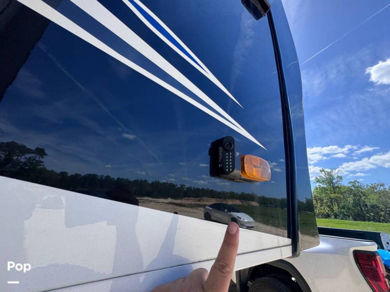 A photo of this 2023 Forest River Riverstone 45BATH Toy Hauler