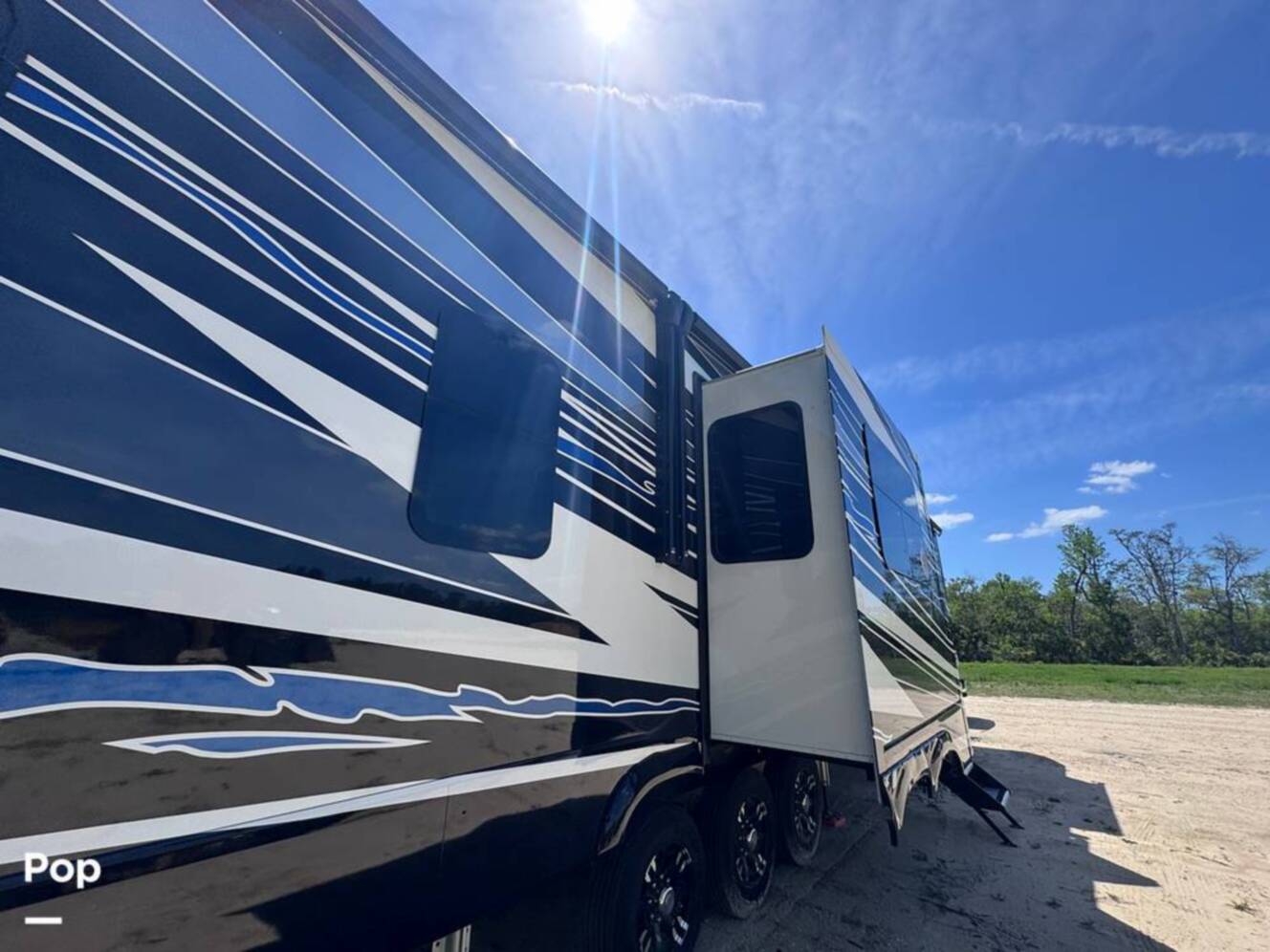 A photo of this 2023 Forest River Riverstone 45BATH Toy Hauler