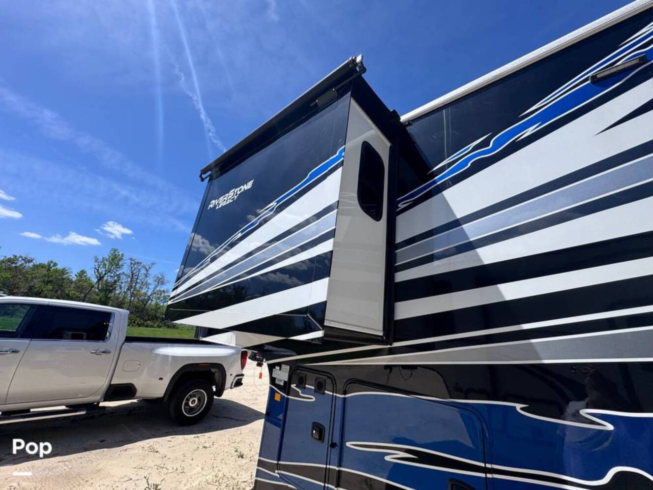 A photo of this 2023 Forest River Riverstone 45BATH Toy Hauler